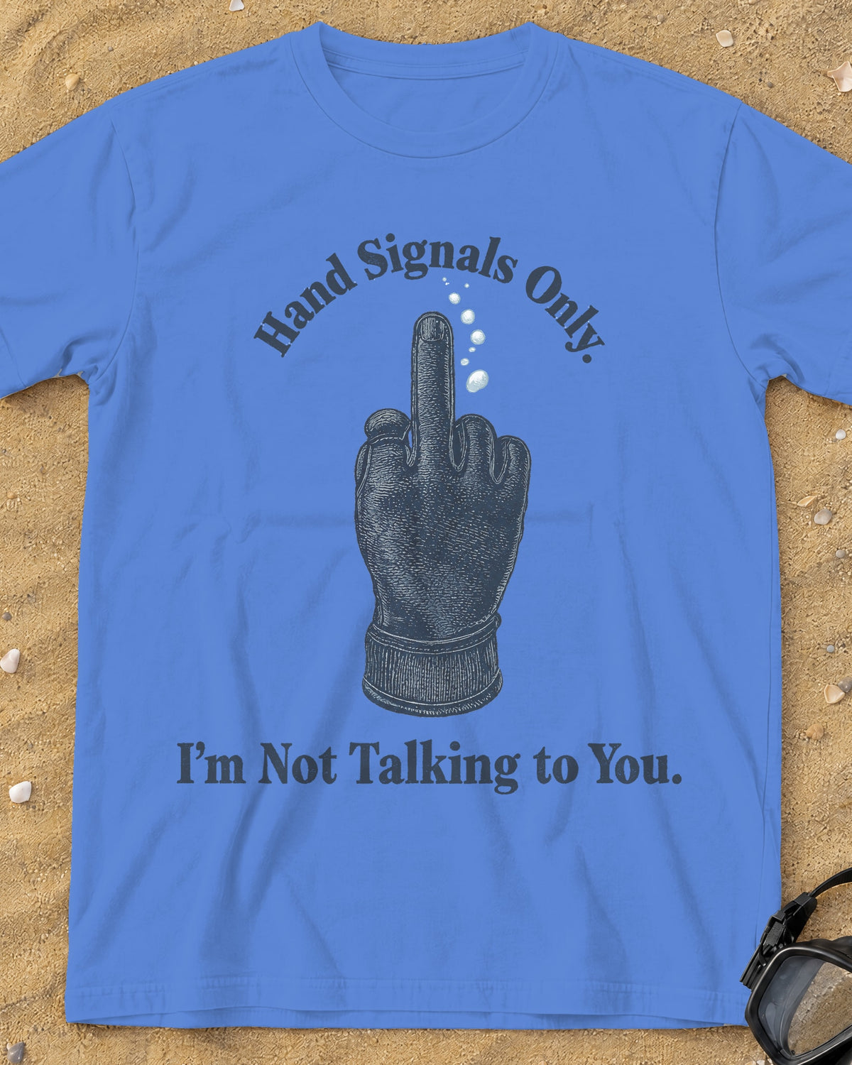 Mystic Blue Hand Signals Only tee on a sandy beach