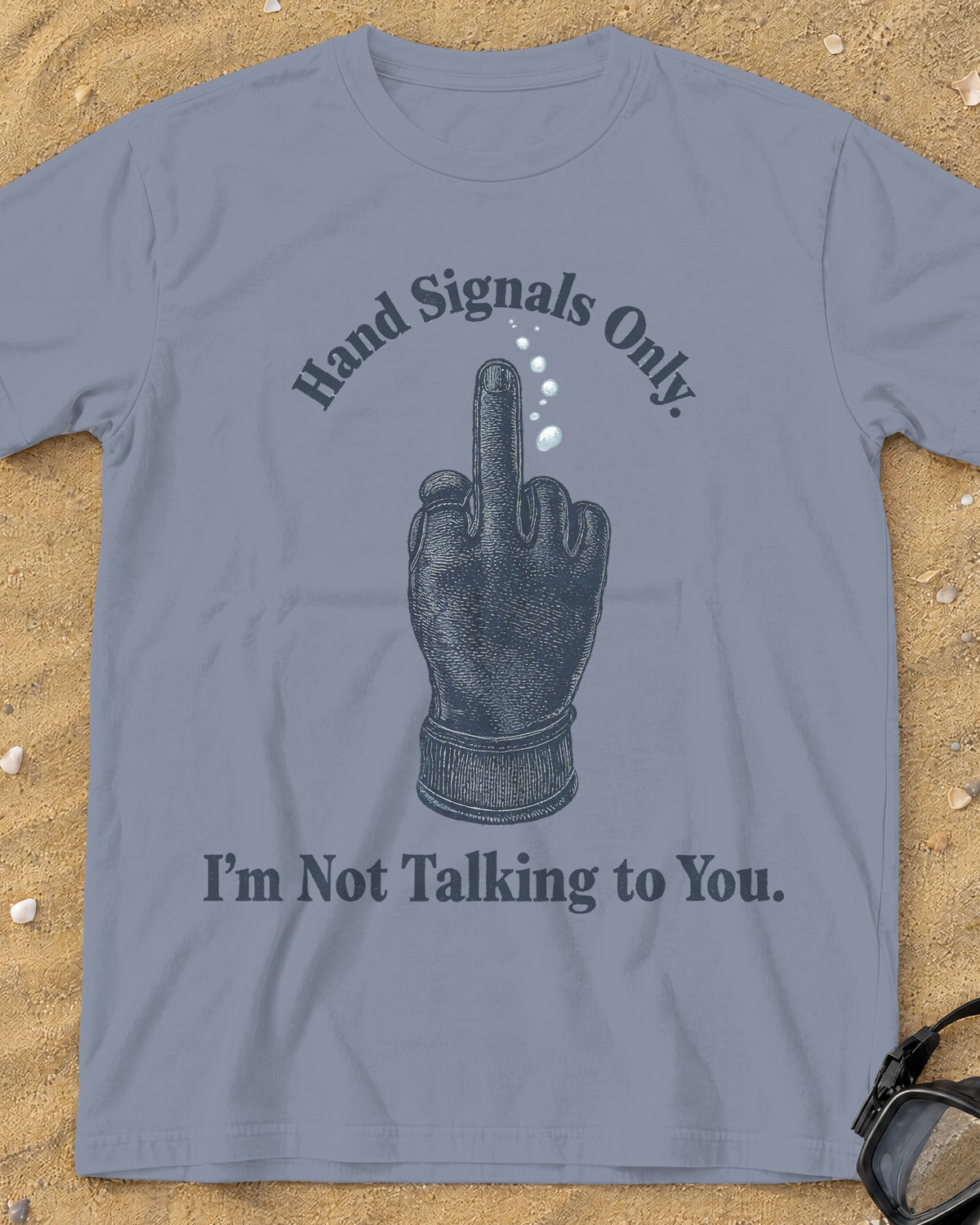 Washed Denim Hand Signals Only tee on a sandy beach