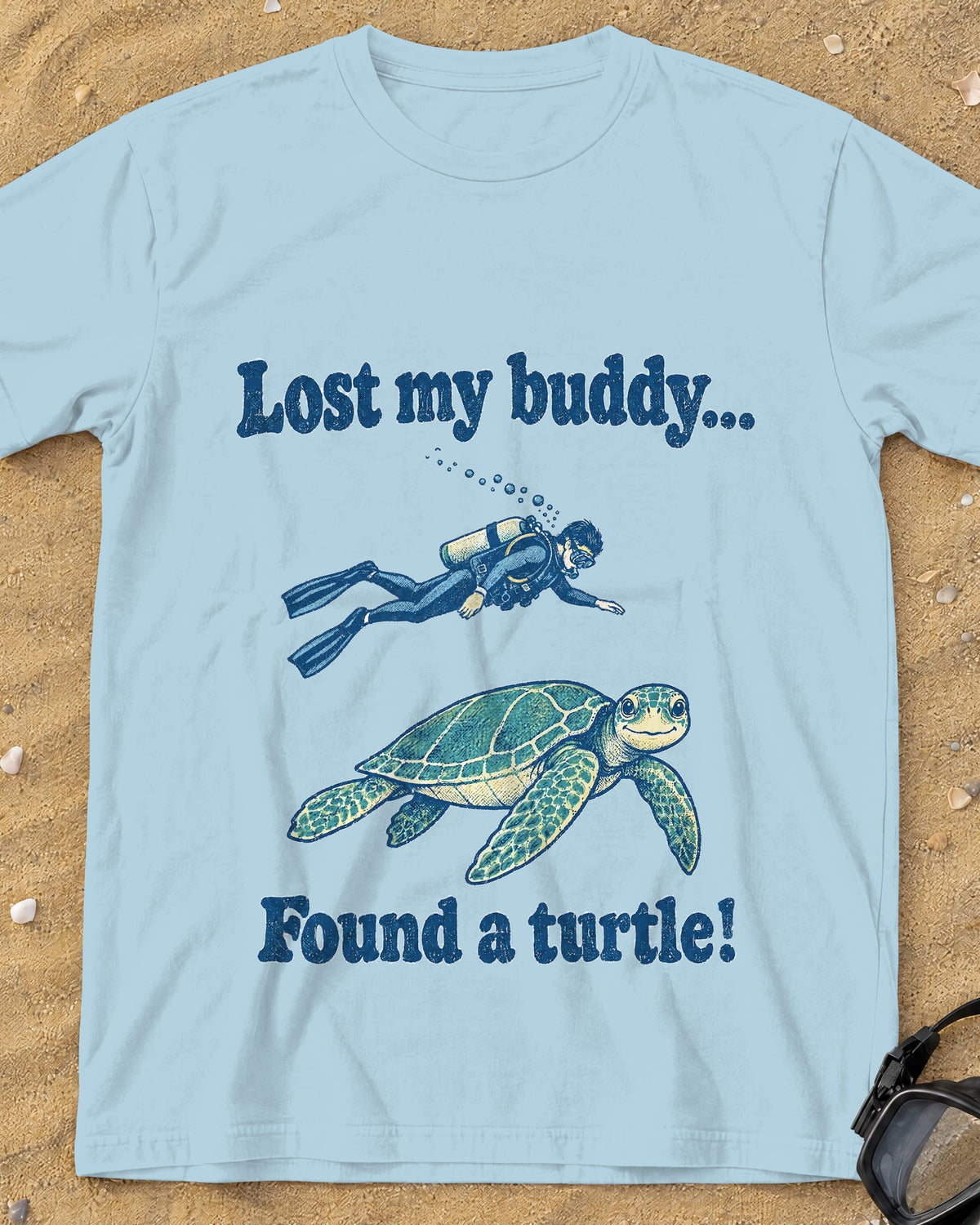 Chambray Lost My Buddy. Found a Turtle! tee on a sandy beach