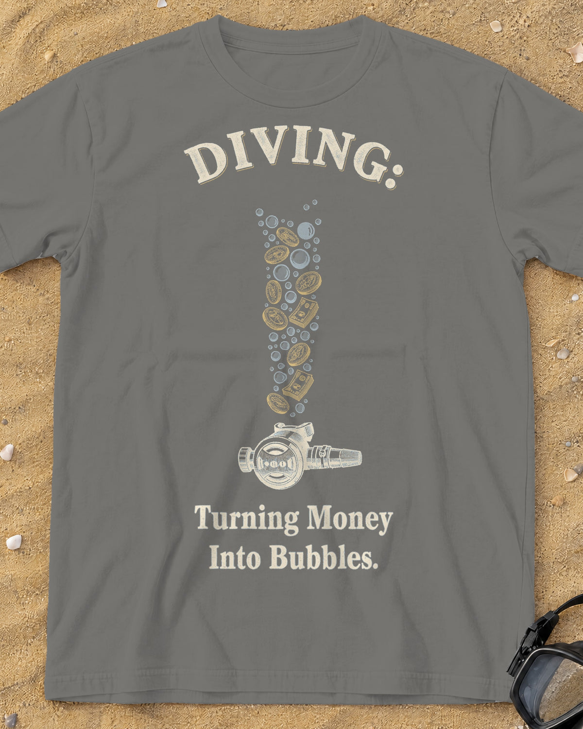 Grey Diving: Turning Money Into Bubbles tee on a sandy beach