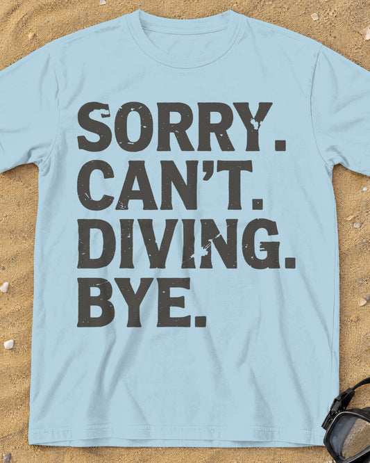 Chambray Sorry. Can't. Diving. Bye. tee on a sandy beach