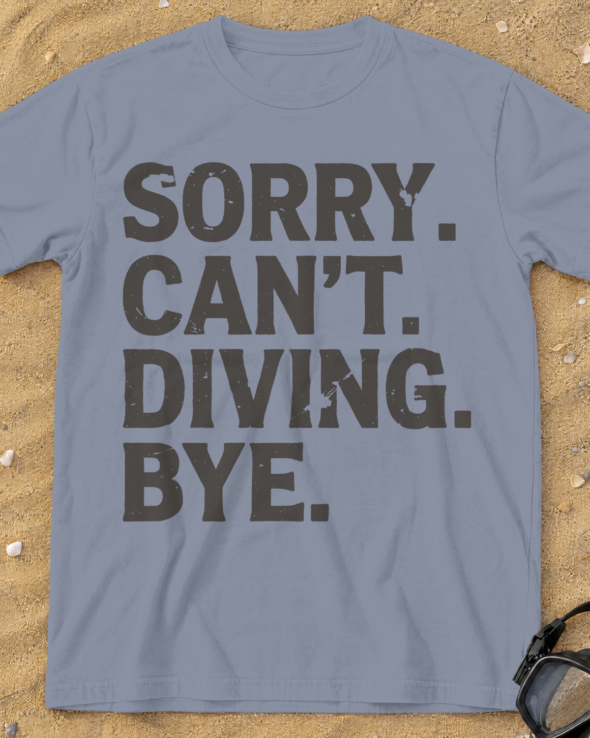 Washed Denim Sorry. Can't. Diving. Bye. tee on a sandy beach
